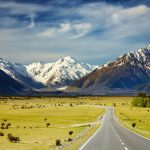 Visit-New-Zealand-Landscape-With-Road-and-Snowy-Mountains-Southern-Alps-New-Zealand-1600×1047